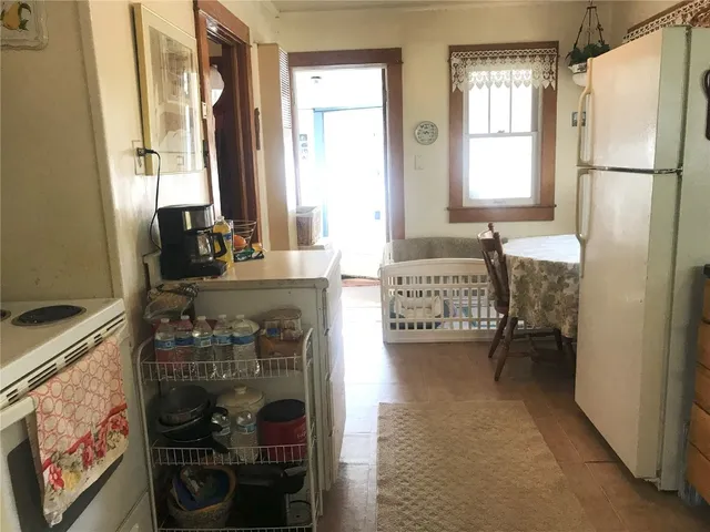 a en suite bathroom with a granite countertop double vanity and a shower
