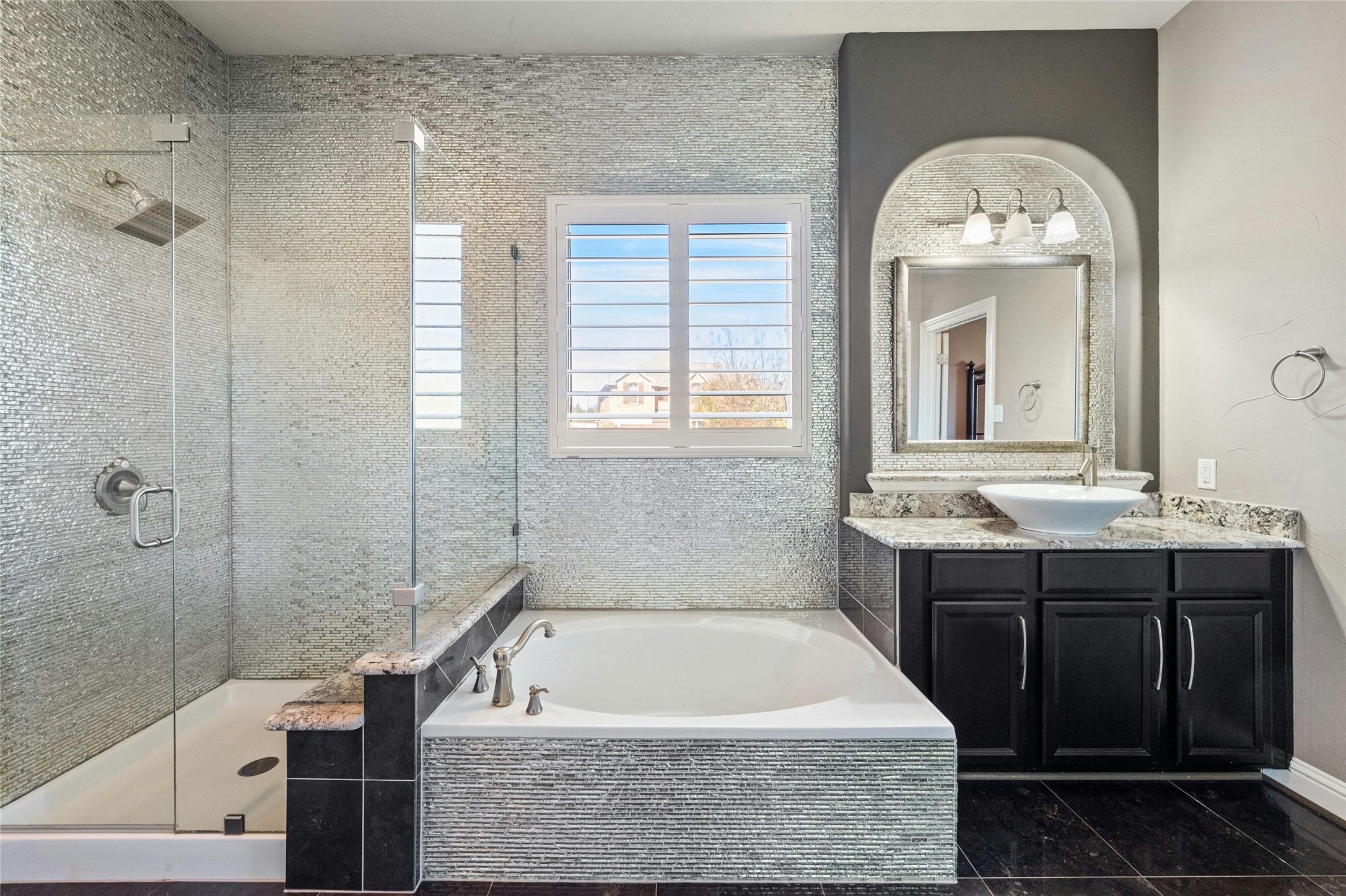 8501 High Summit Lane Austin, TX 78737 - Photo 18 of 38 a bathroom with a tub a sink and mirror