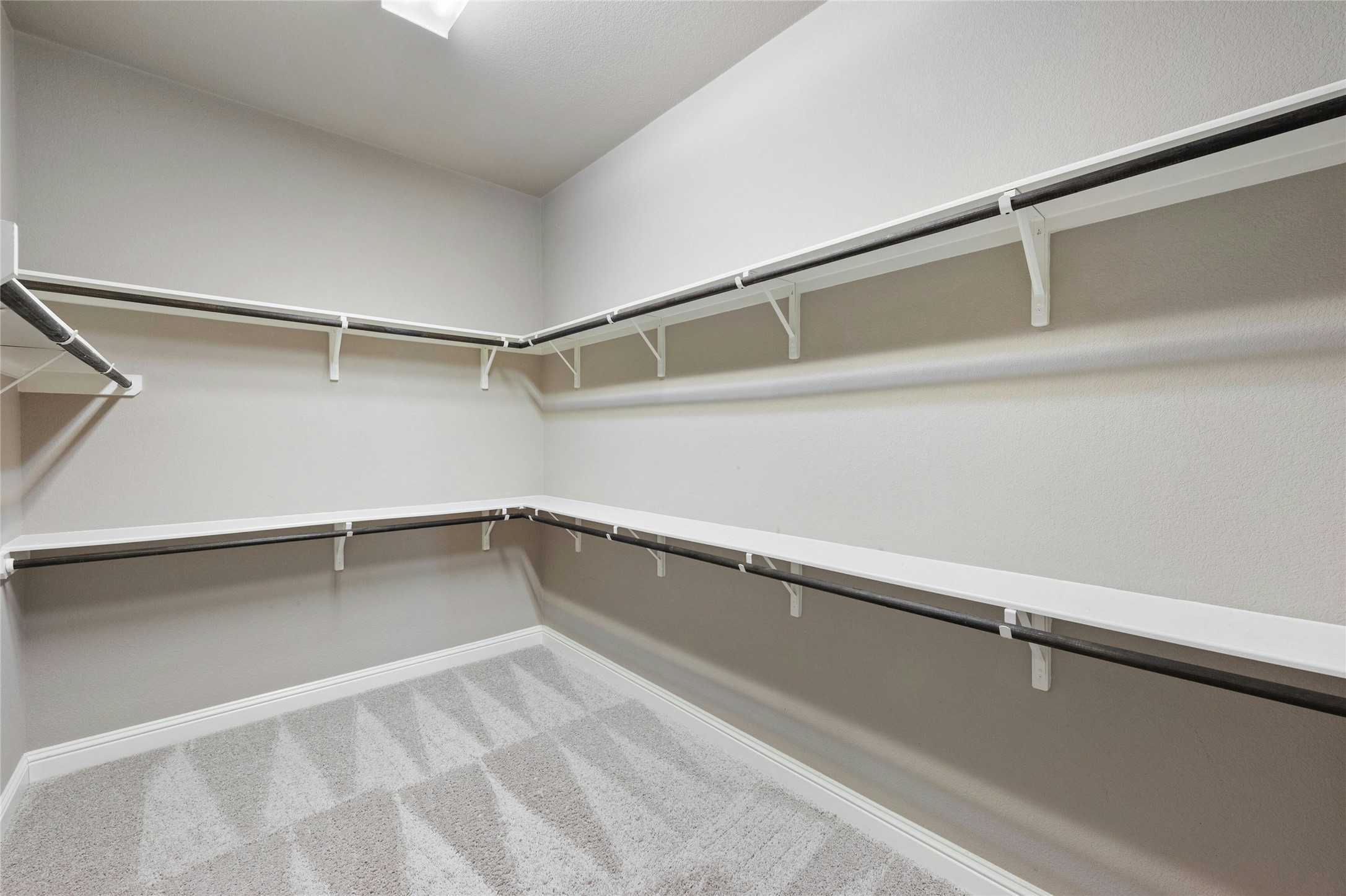 8501 High Summit Lane Austin, TX 78737 - Photo 19 of 38 a view of an empty walk in closet