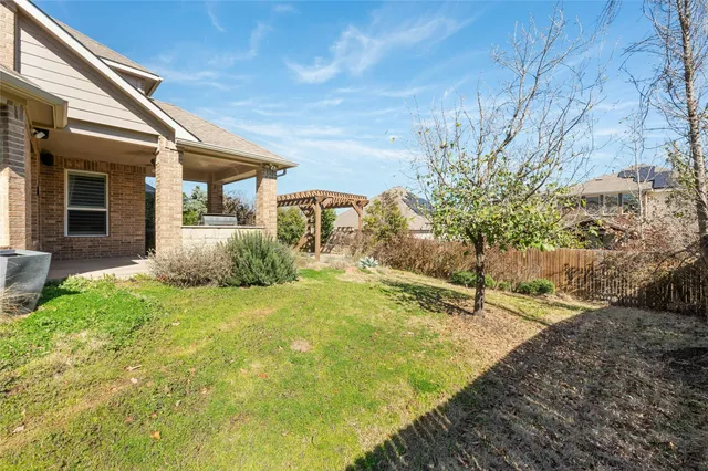 a house view with a backyard space