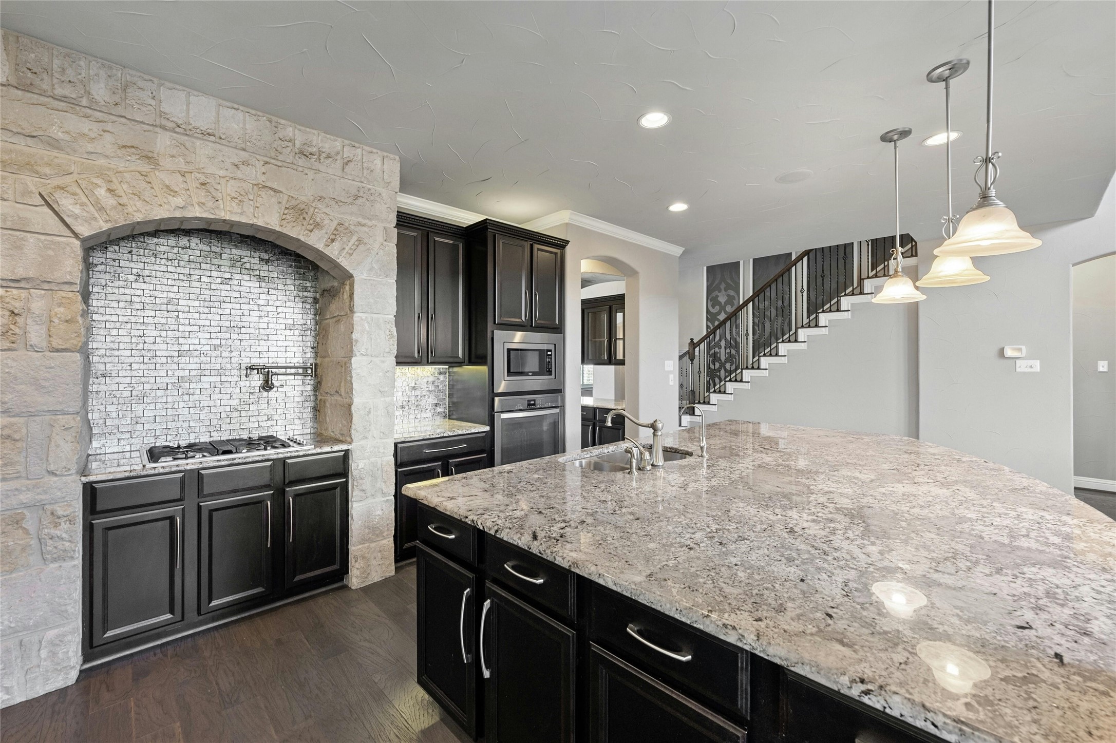 8501 High Summit Lane Austin, TX 78737 - Photo 6 of 38 a kitchen with stainless steel appliances granite countertop a sink and stove