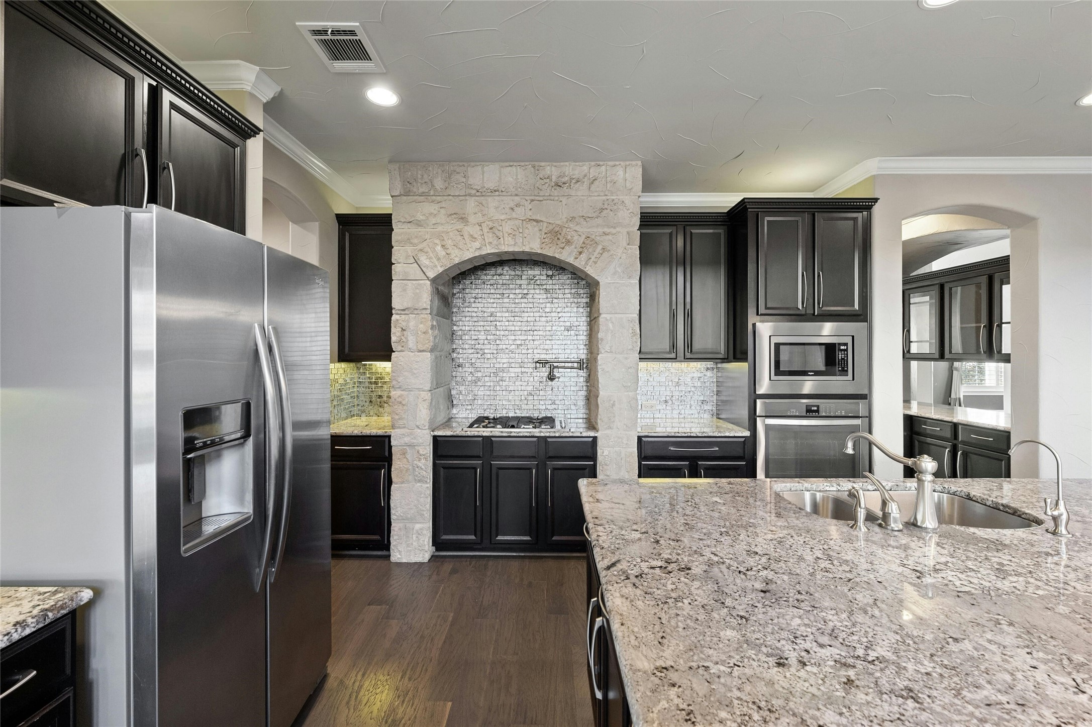 8501 High Summit Lane Austin, TX 78737 - Photo 7 of 38 a kitchen with stainless steel appliances granite countertop a refrigerator and a stove