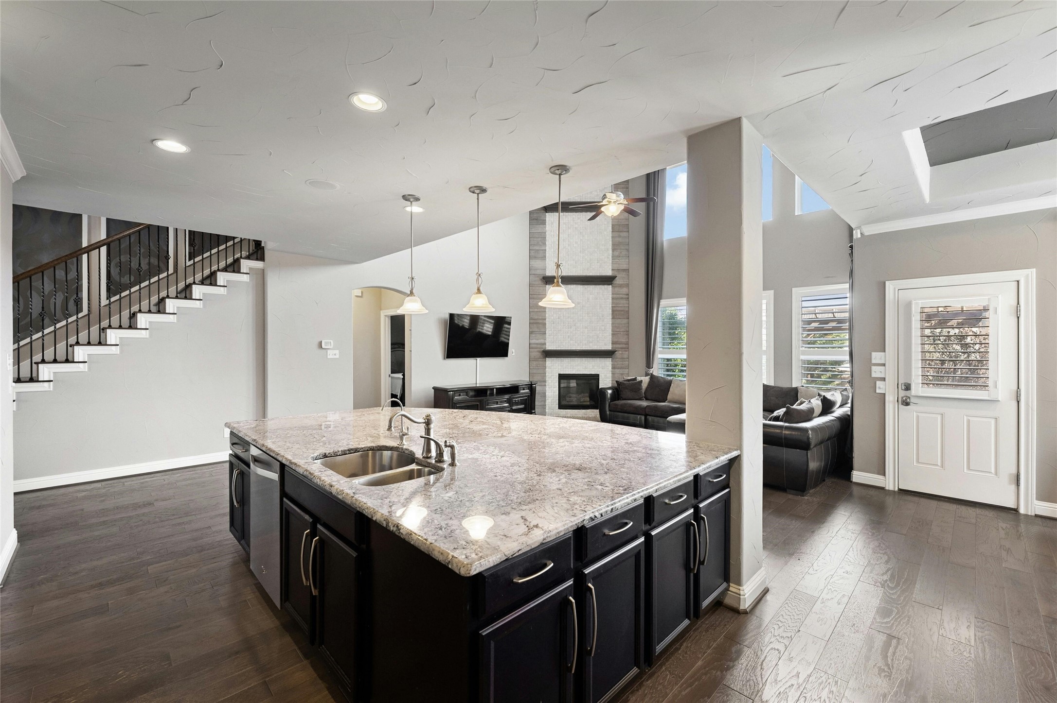 8501 High Summit Lane Austin, TX 78737 - Photo 8 of 38 a kitchen with stainless steel appliances granite countertop lots of counter top space and wooden floor