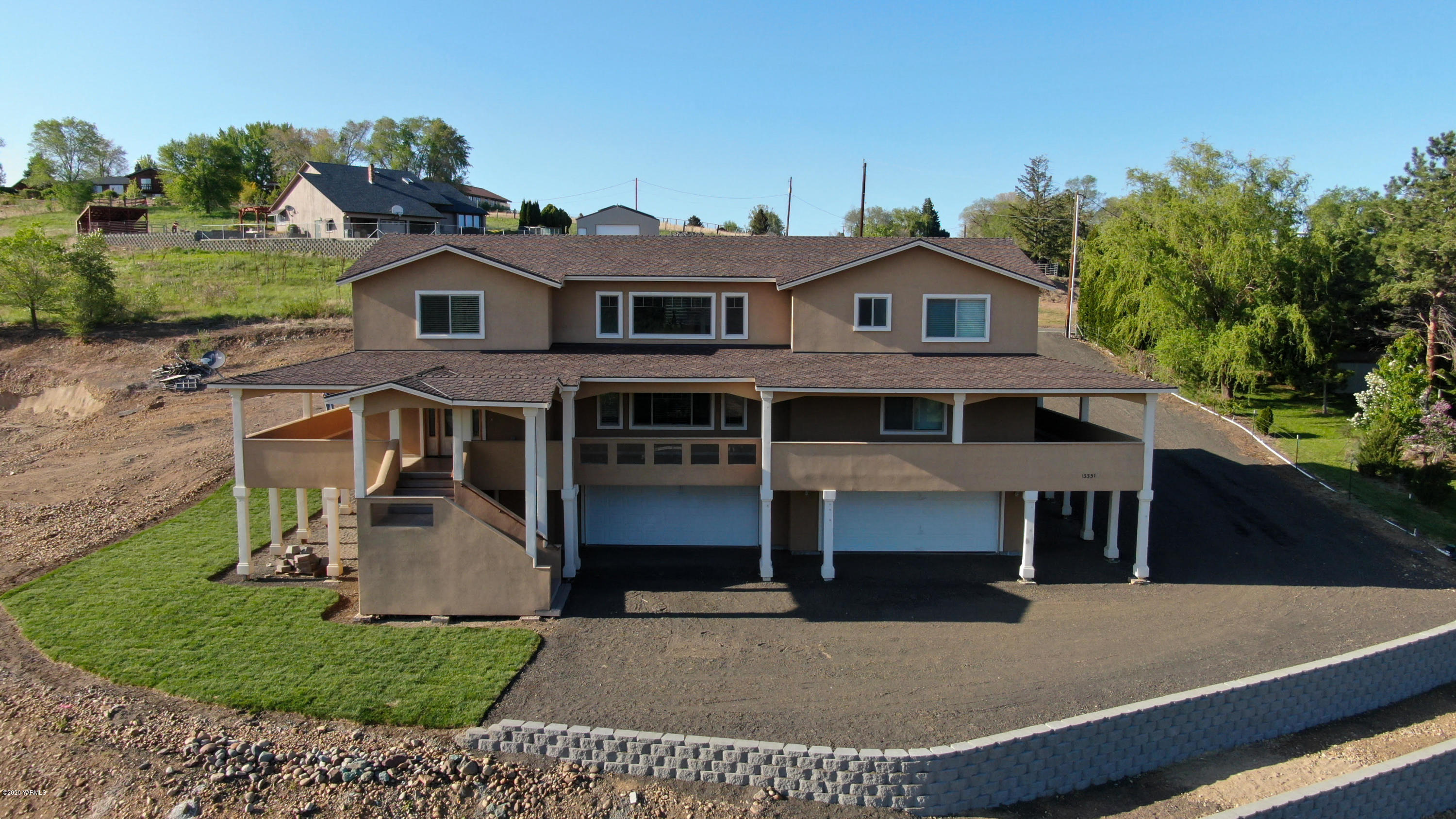 13351 Wide Hollow Road Yakima, WA 98908 - Photo 2 of 31 a front view of a house with a yard
