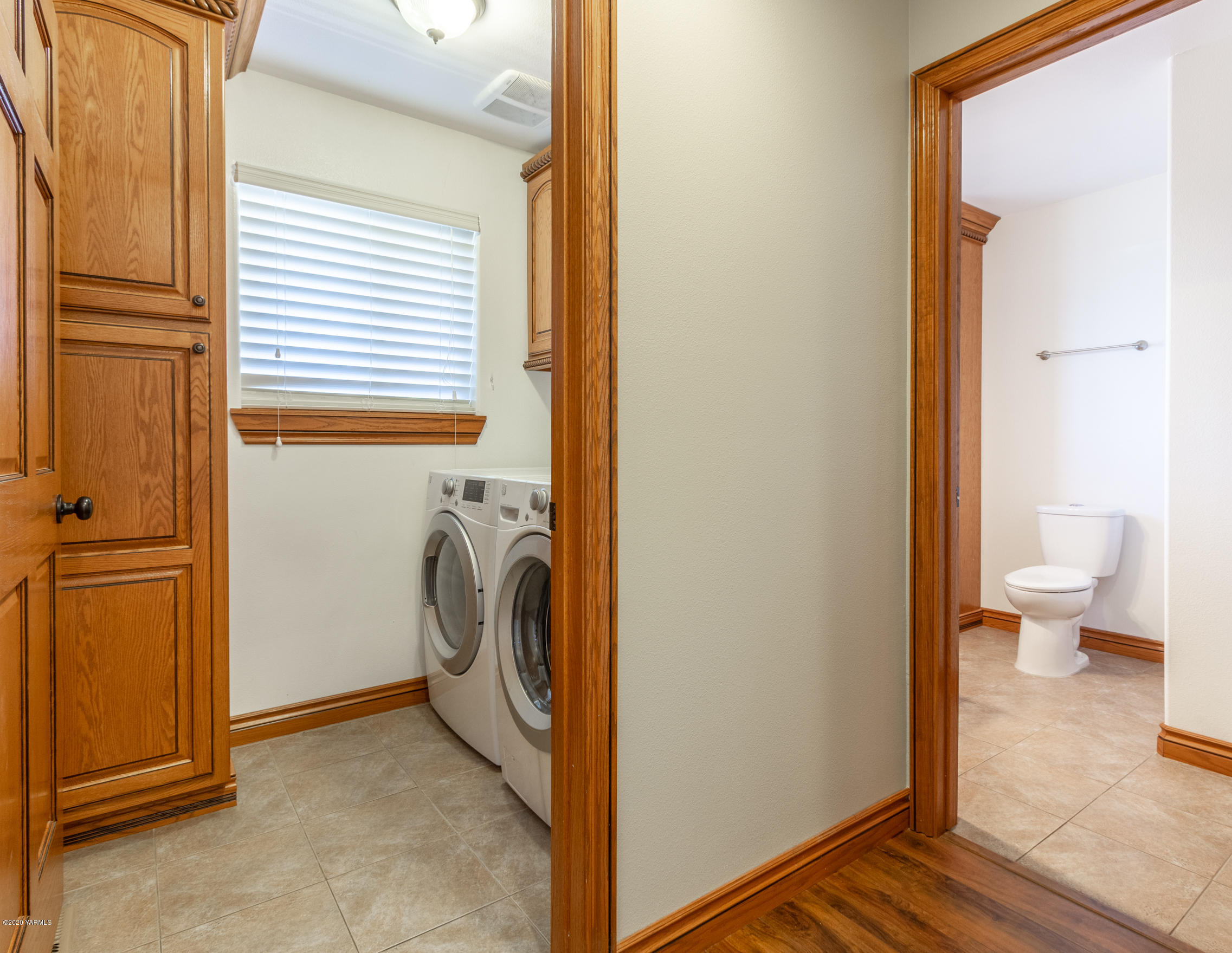 13351 Wide Hollow Road Yakima, WA 98908 - Photo 12 of 31 a view of a bathroom with washing machine and a view of a hallway