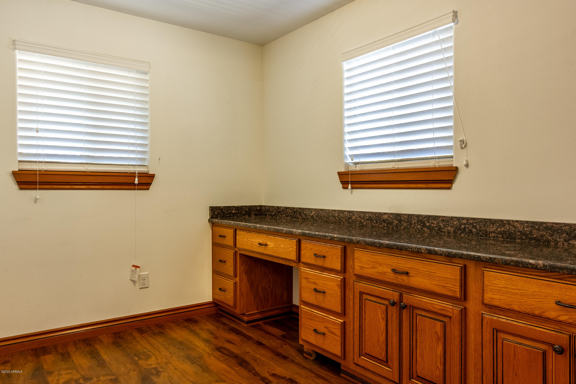 13351 Wide Hollow Road Yakima, WA 98908 - Photo 13 of 31 a view of a kitchen with wooden floor and a window