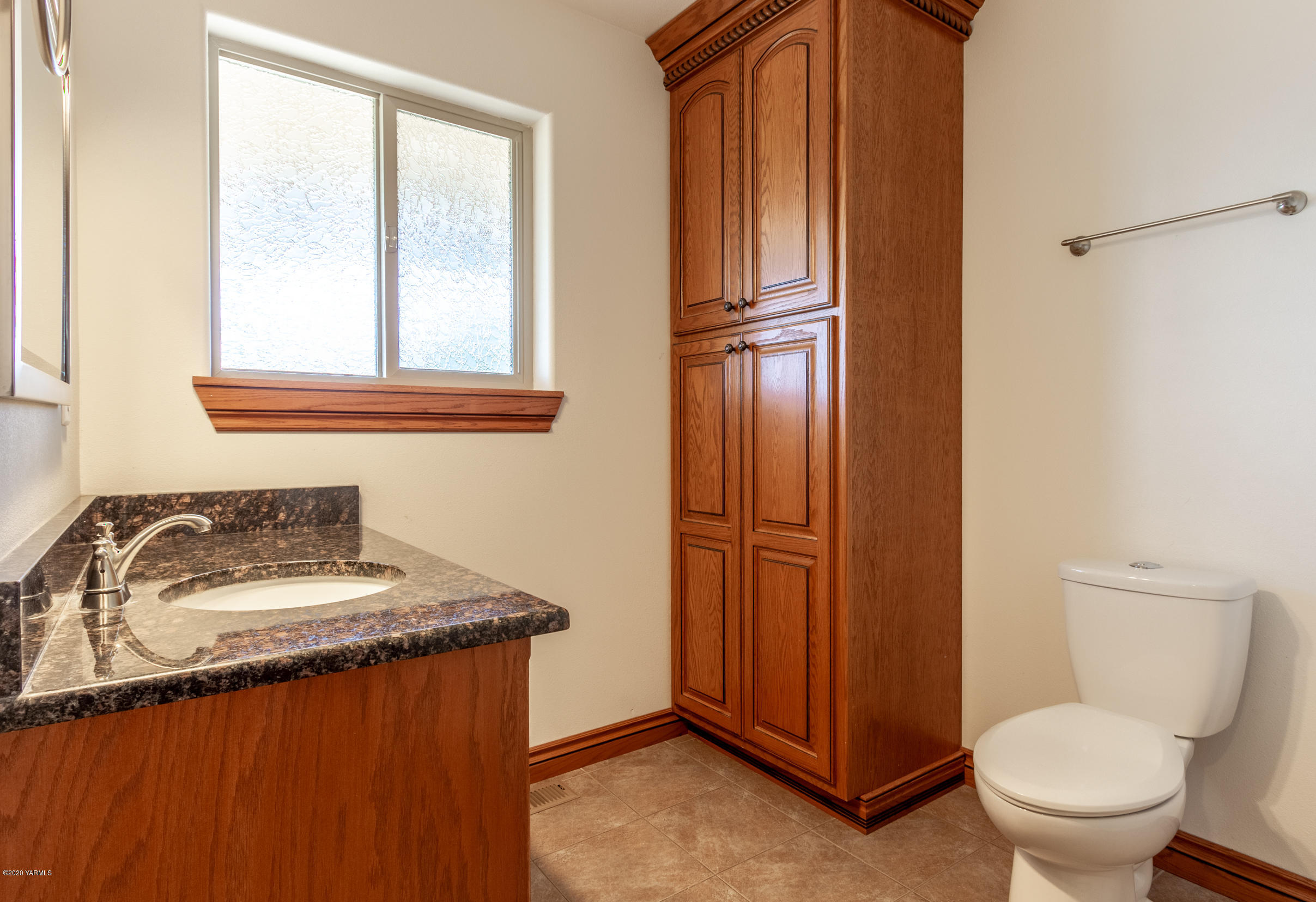 13351 Wide Hollow Road Yakima, WA 98908 - Photo 14 of 31 a bathroom with a sink a toilet and mirror