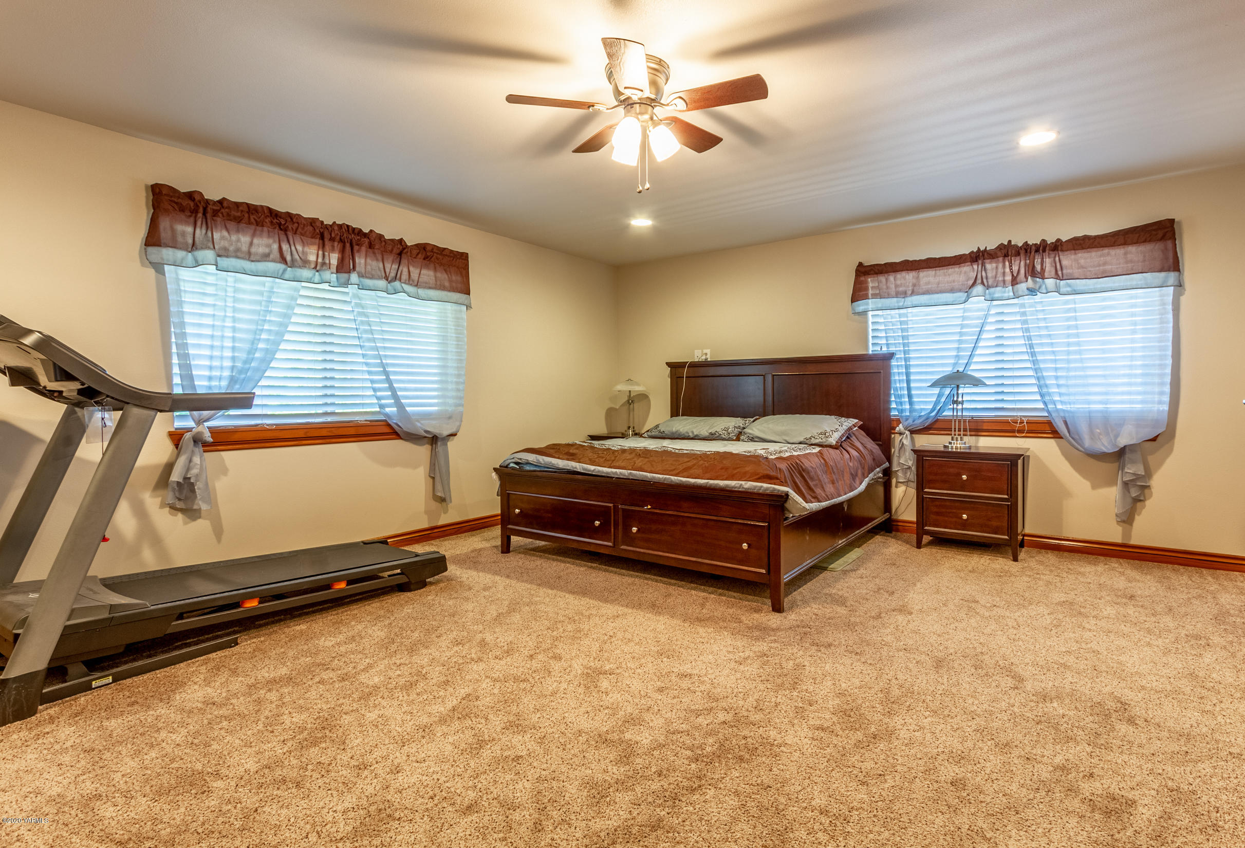 13351 Wide Hollow Road Yakima, WA 98908 - Photo 15 of 31 a bedroom with a bed and a chandelier