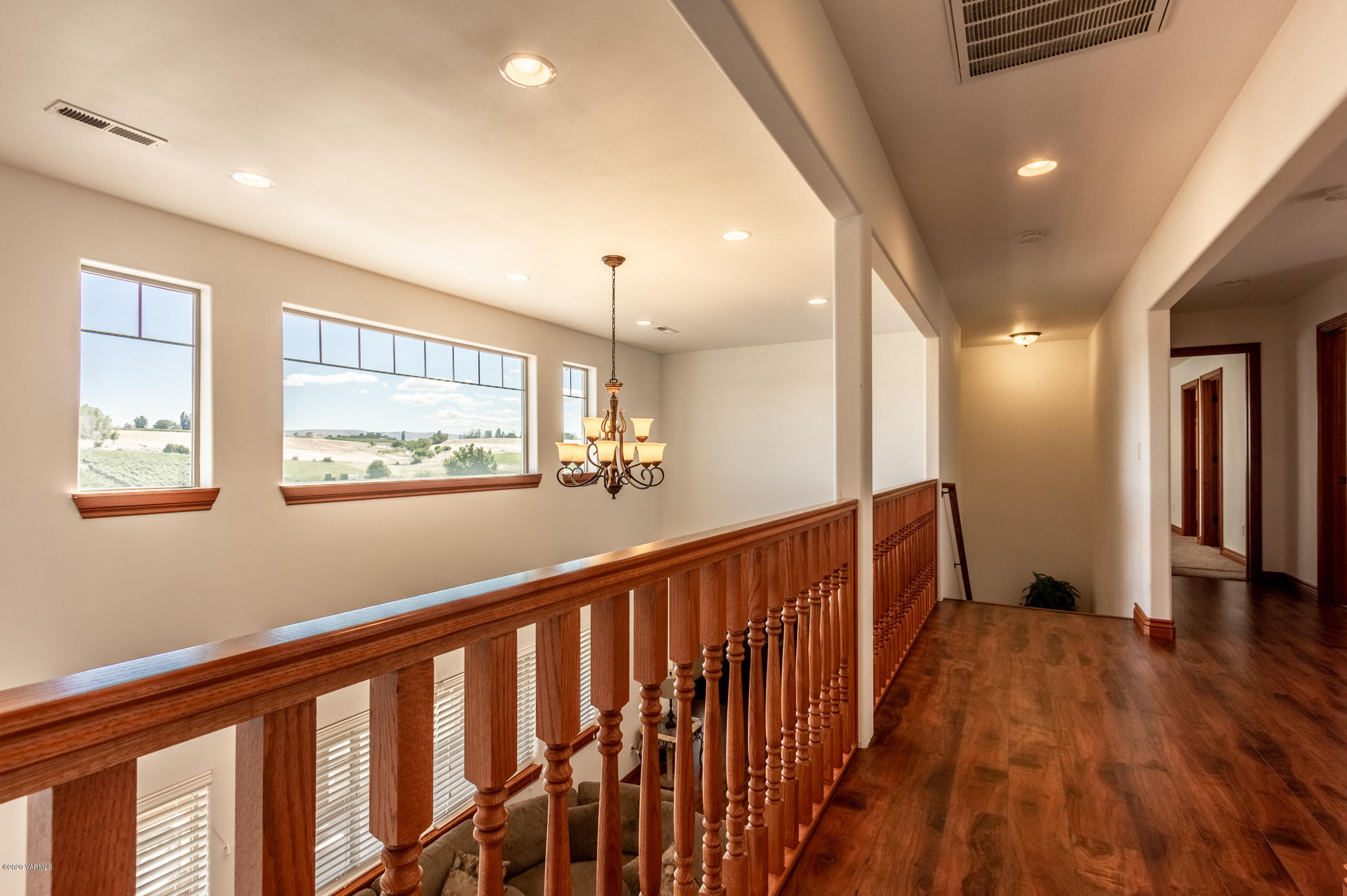 13351 Wide Hollow Road Yakima, WA 98908 - Photo 17 of 31 a view of a hallway with wooden floor and stairs