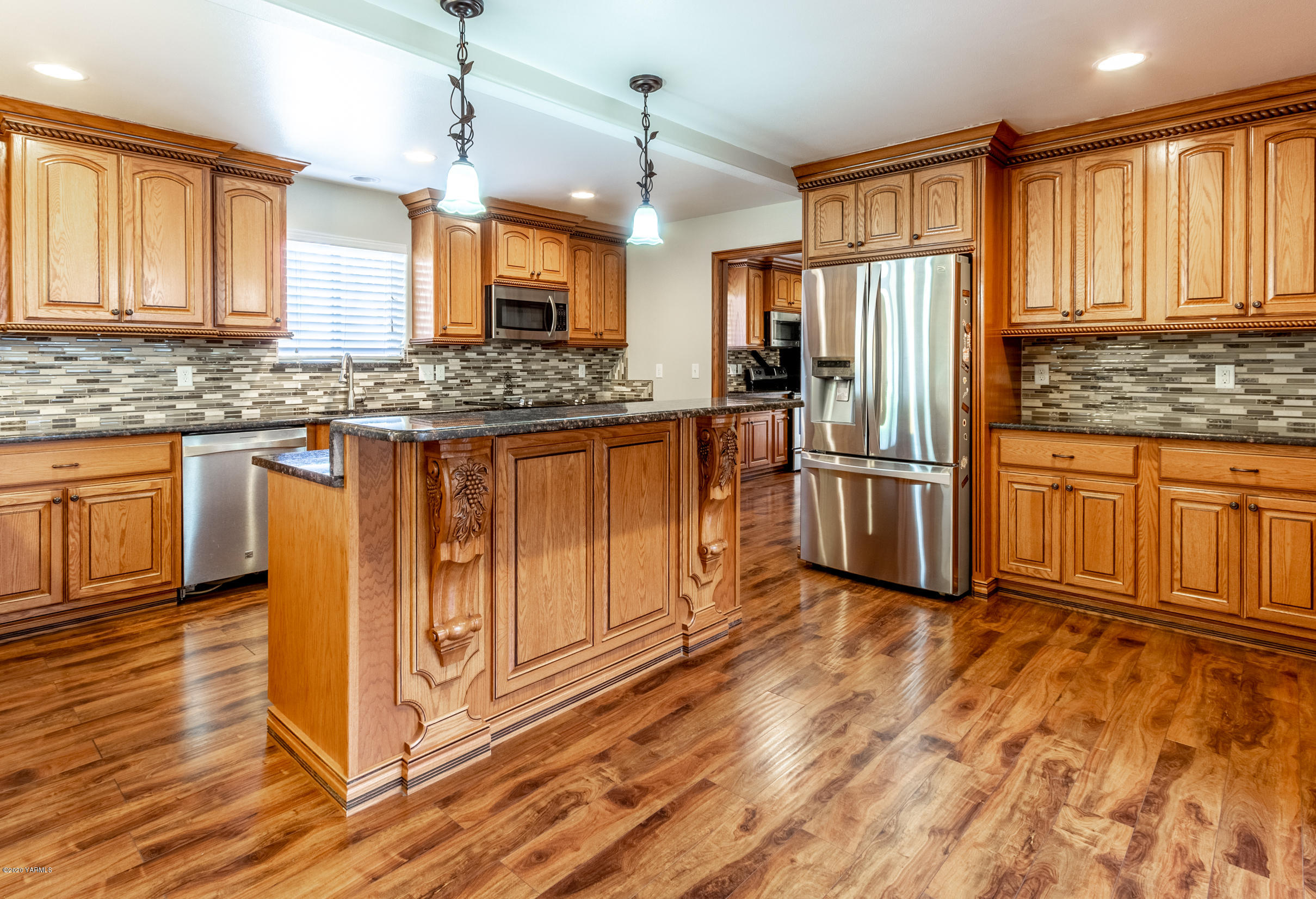 13351 Wide Hollow Road Yakima, WA 98908 - Photo 6 of 31 a kitchen with stainless steel appliances granite countertop a refrigerator a stove and a sink