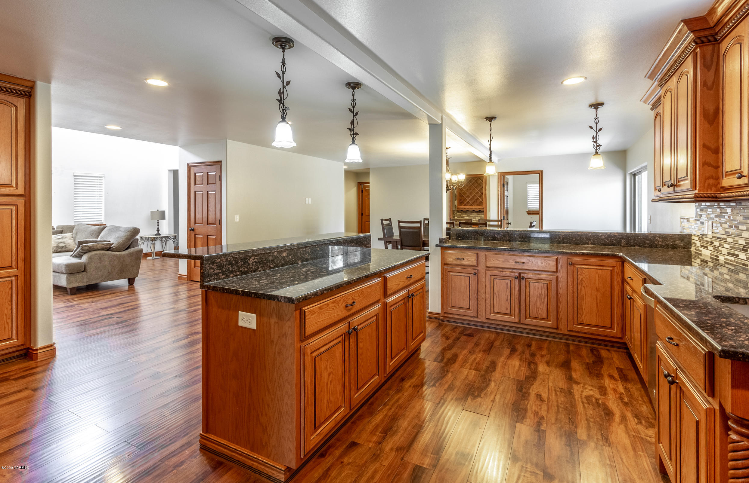 13351 Wide Hollow Road Yakima, WA 98908 - Photo 8 of 31 a large kitchen with stainless steel appliances granite countertop a stove and a sink