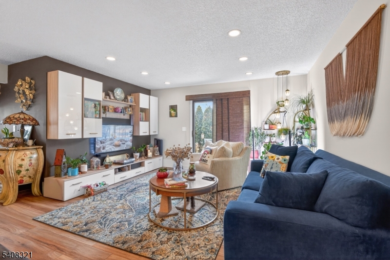 400 Daisy Court Jackson, NJ 08527 - Photo 14 of 29 a living room with furniture fireplace and a table