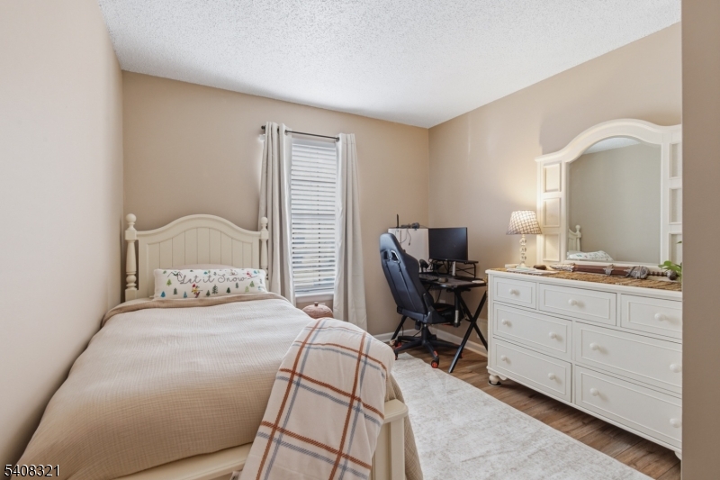 400 Daisy Court Jackson, NJ 08527 - Photo 20 of 29 a bedroom with a bed and a desk