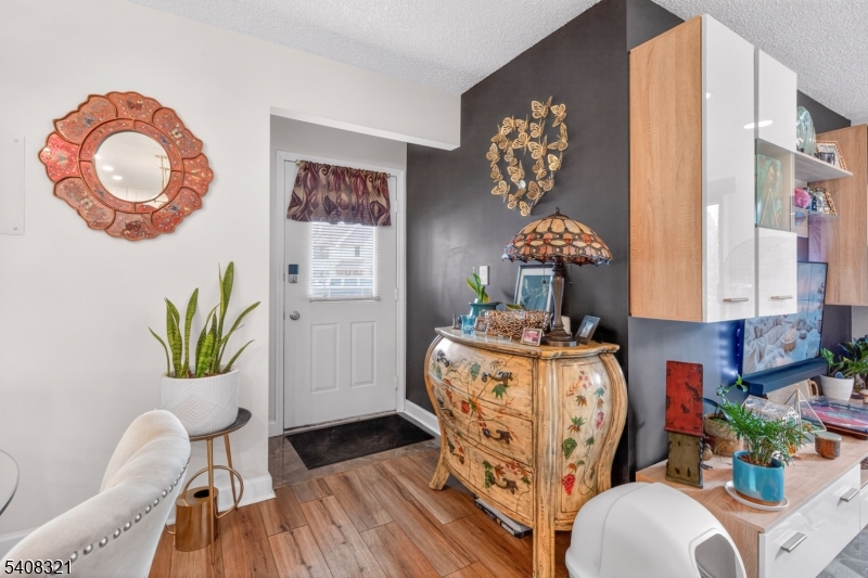 400 Daisy Court Jackson, NJ 08527 - Photo 3 of 29 a living room with furniture and a chandelier
