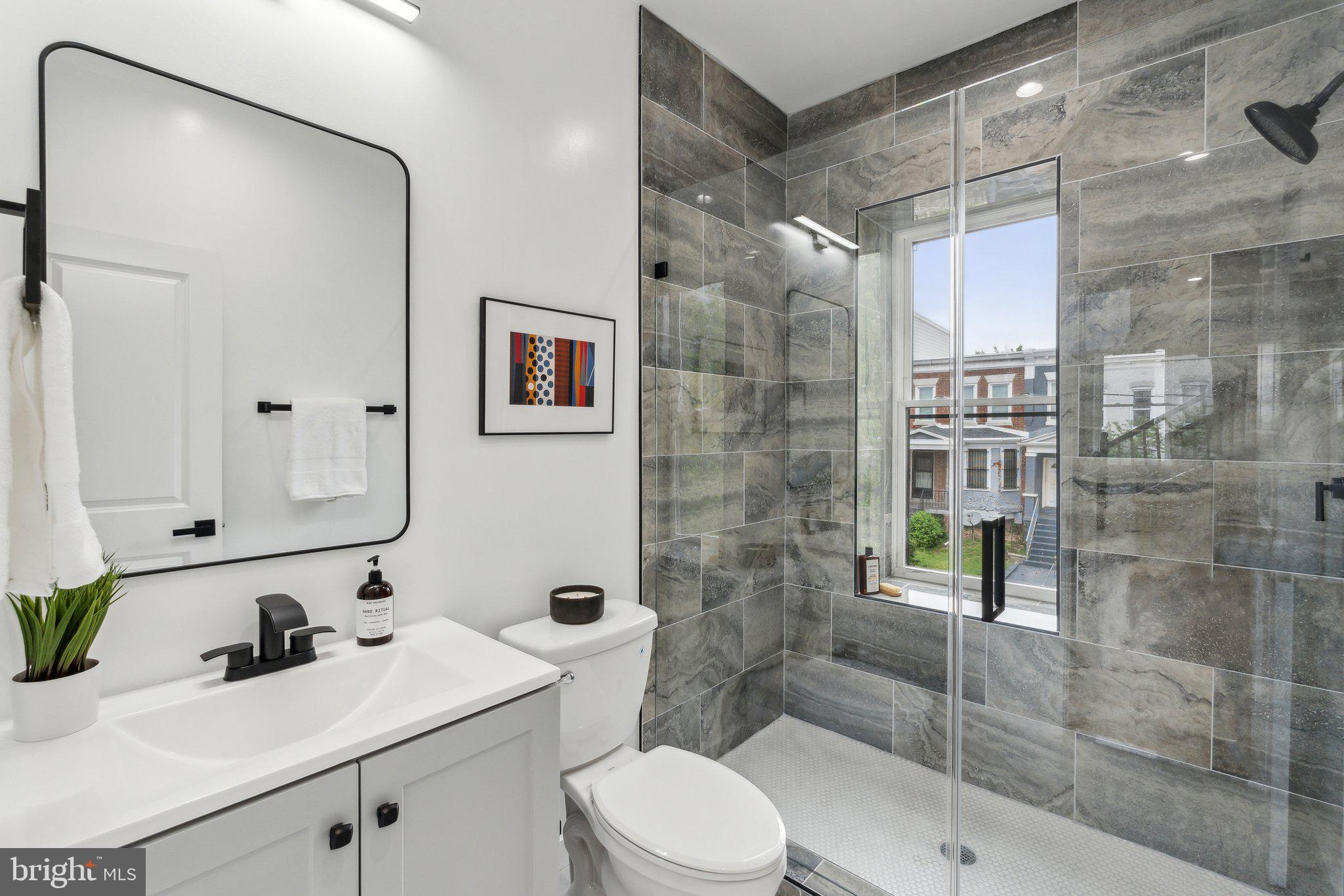 660 Columbia Road Northwest Washington, DC 20001 - Photo 12 of 44 a bathroom with a sink toilet and shower
