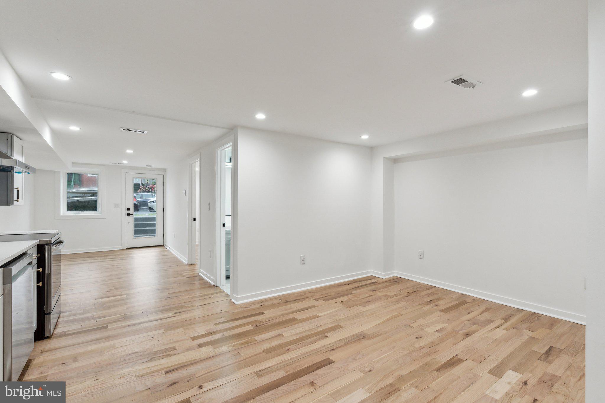 660 Columbia Road Northwest Washington, DC 20001 - Photo 26 of 44 a view of empty room with wooden floor