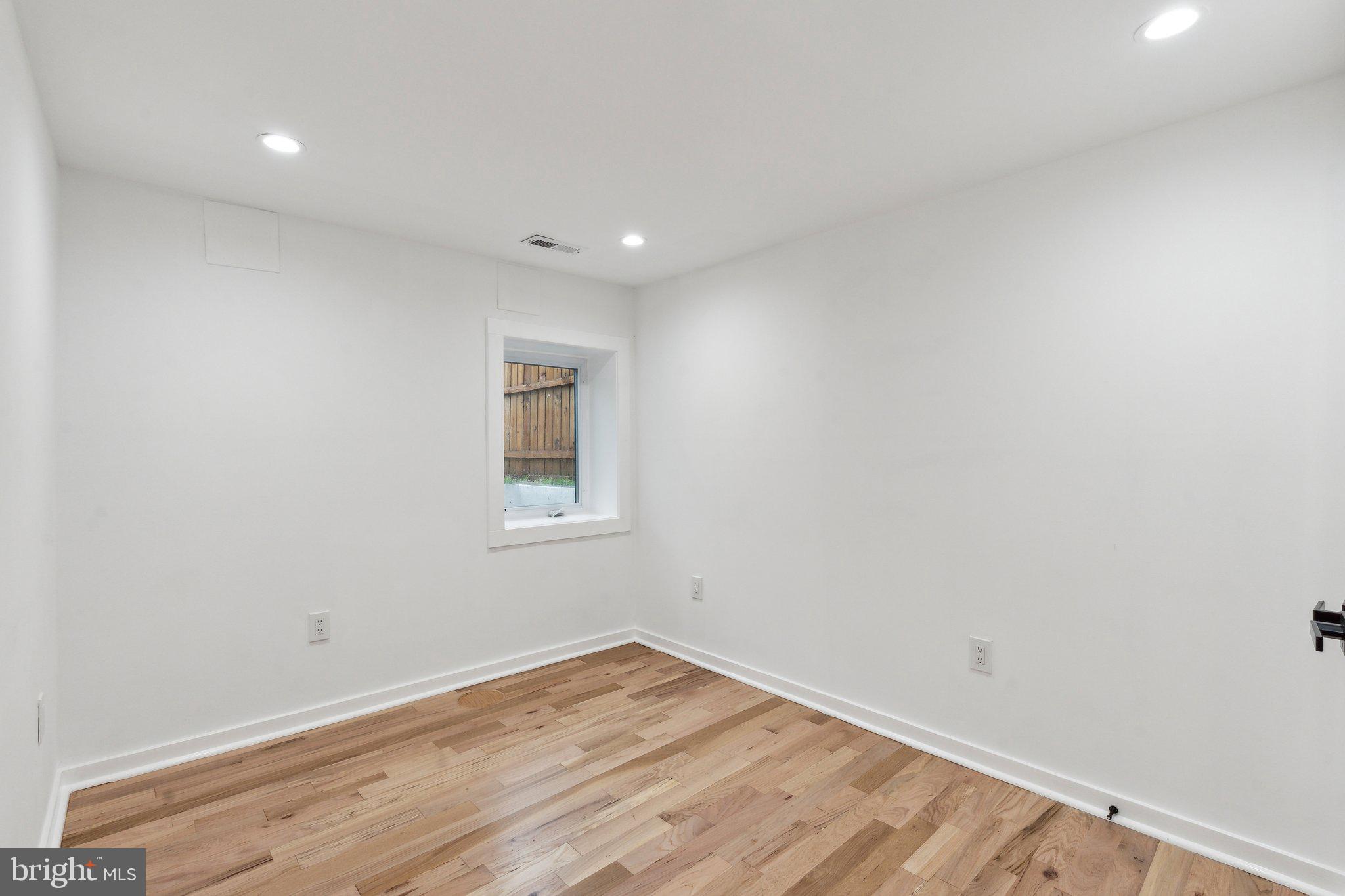 660 Columbia Road Northwest Washington, DC 20001 - Photo 32 of 44 a view of empty room with wooden floor