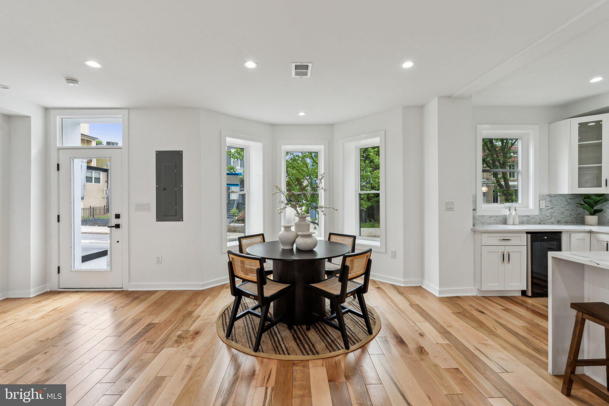 660 Columbia Road Northwest Washington, DC 20001 - Photo 2 of 44 a view of a dining room with furniture and wooden floor