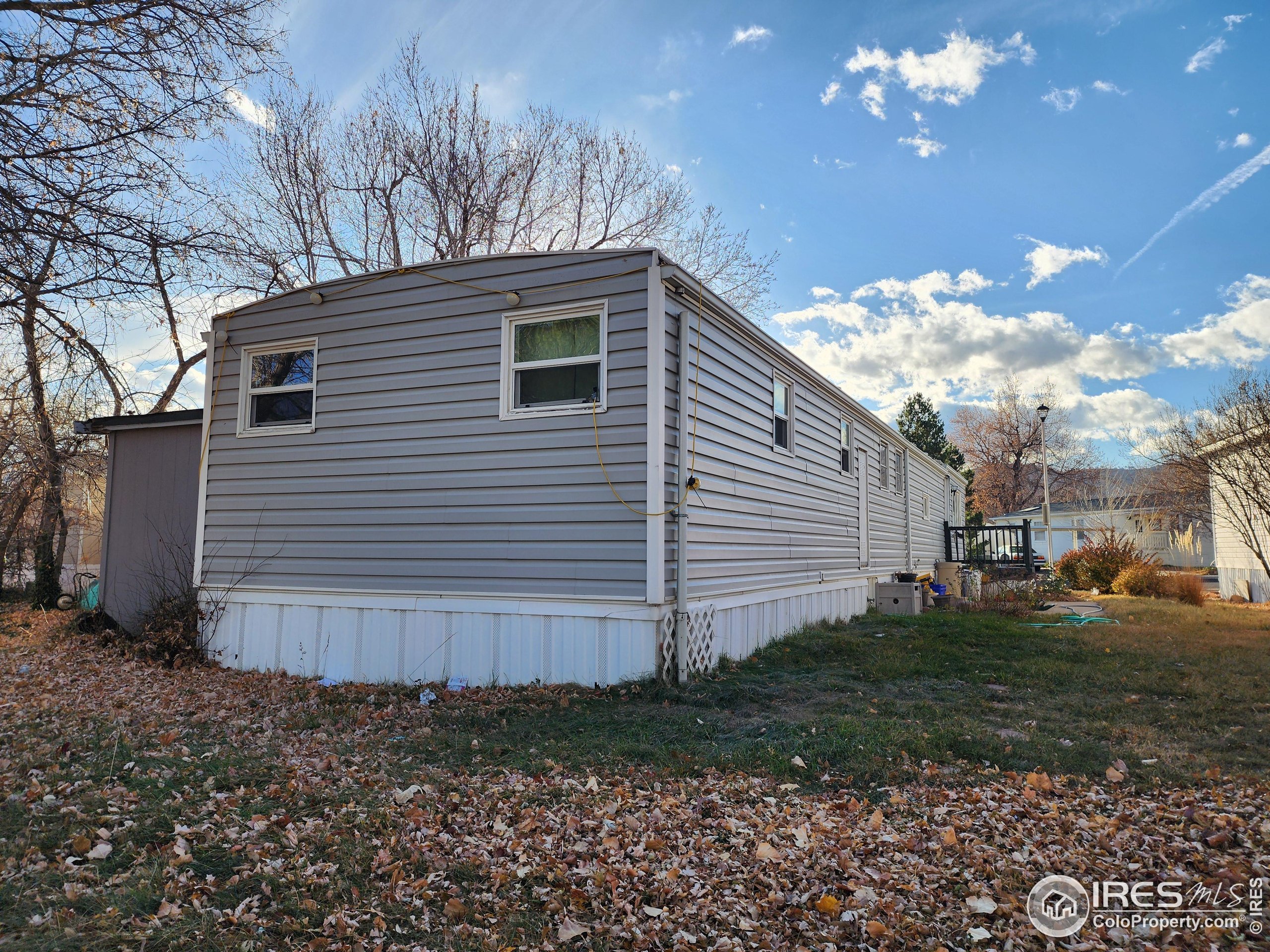4500 19th Street, Unit 111 Boulder, CO 80304 - Photo 14 of 17 a view of a house with a yard