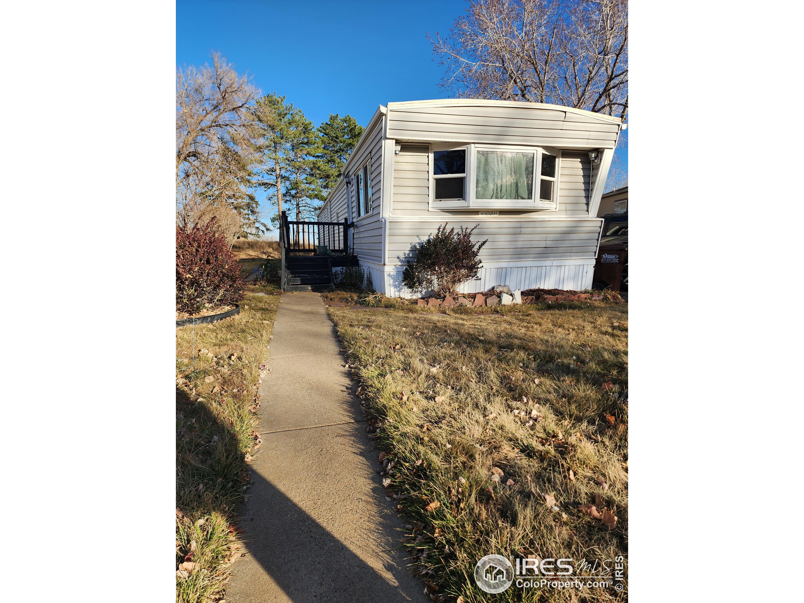 4500 19th Street, Unit 111 Boulder, CO 80304 - Photo 15 of 17 a view of a house with a yard