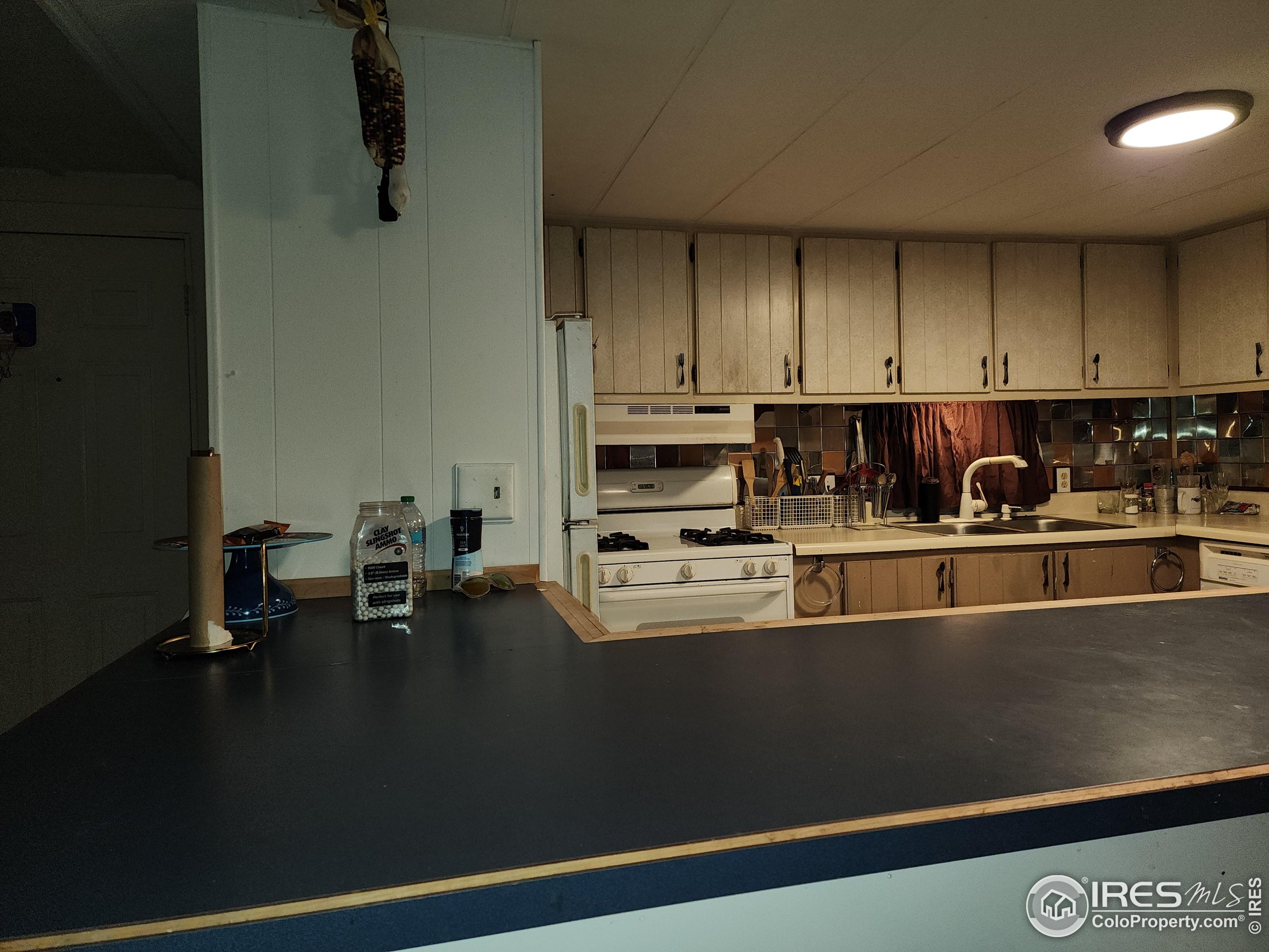 4500 19th Street, Unit 111 Boulder, CO 80304 - Photo 3 of 17 a kitchen with a sink and cabinets