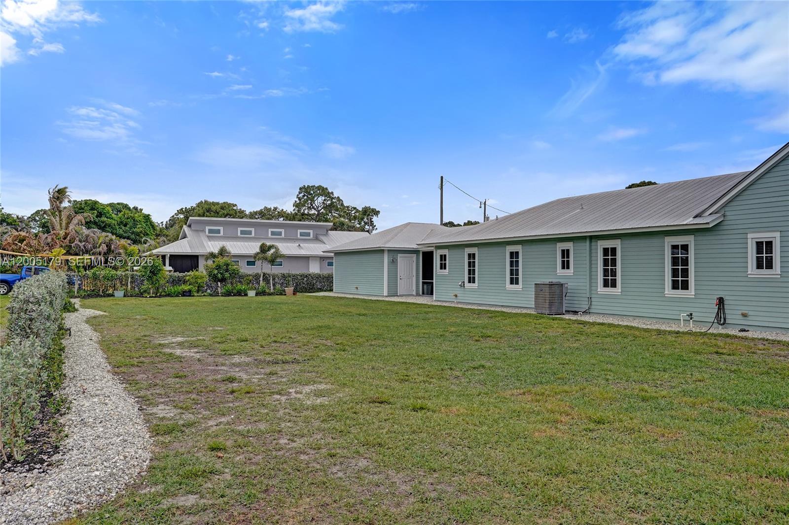 4648 Southeast Binnacle Way Stuart, FL 34997 - Photo 61 of 80 Extra lot view to side of house