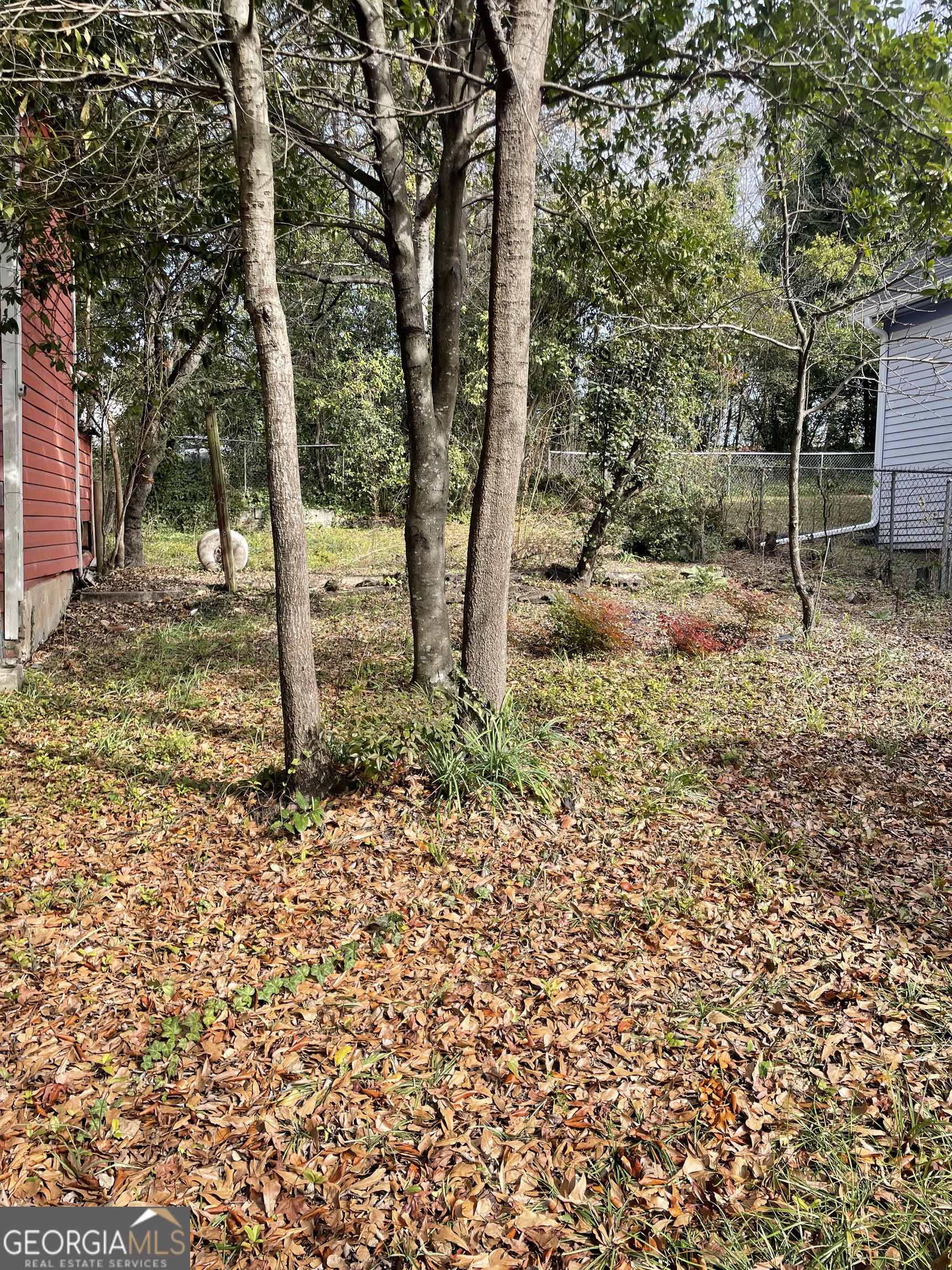 1083 Elm Street Macon, GA 31201 - Photo 3 of 5 a backyard of a house with lots of green space