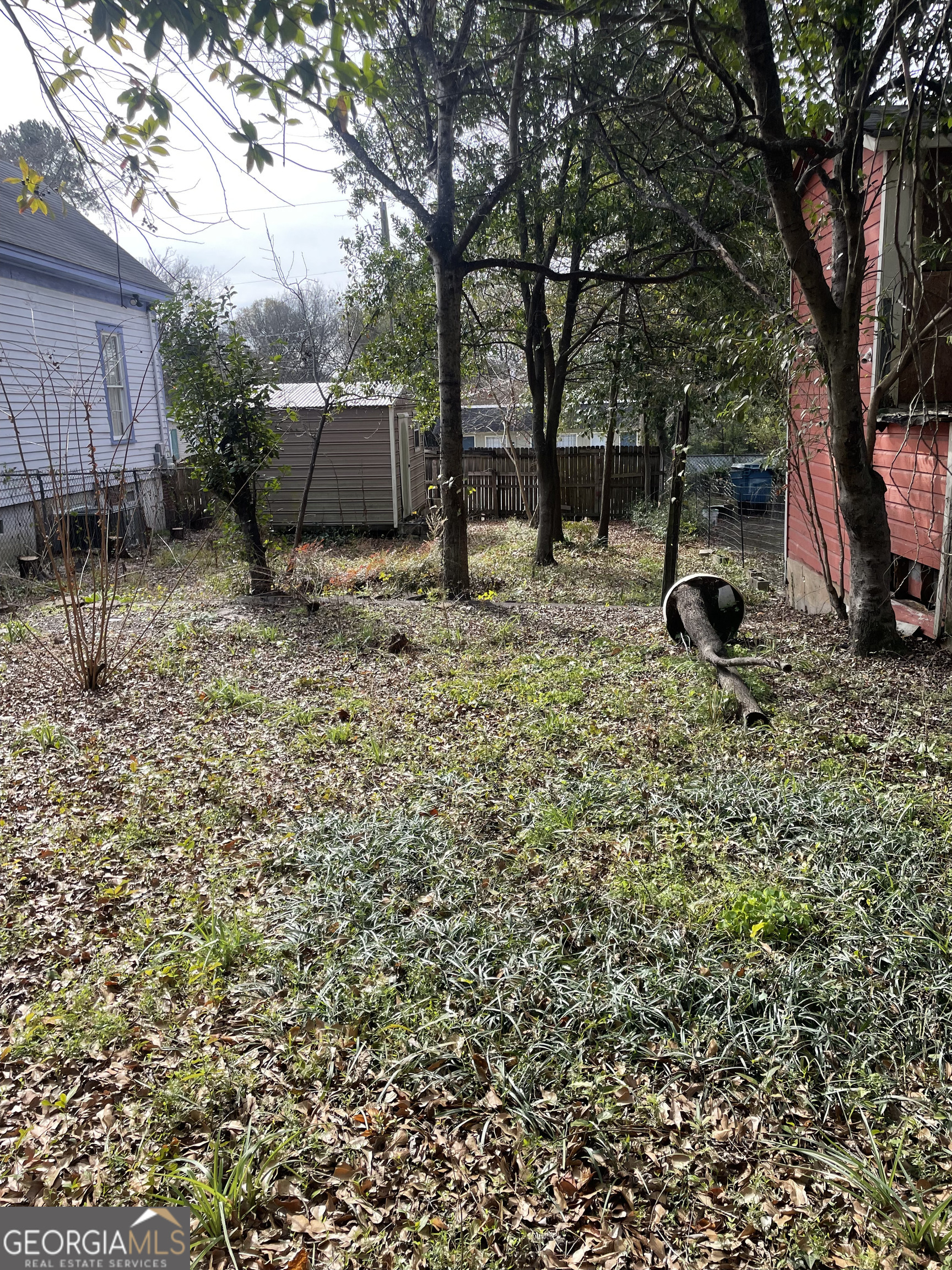 1083 Elm Street Macon, GA 31201 - Photo 4 of 5 a backyard of a house with lots of green space