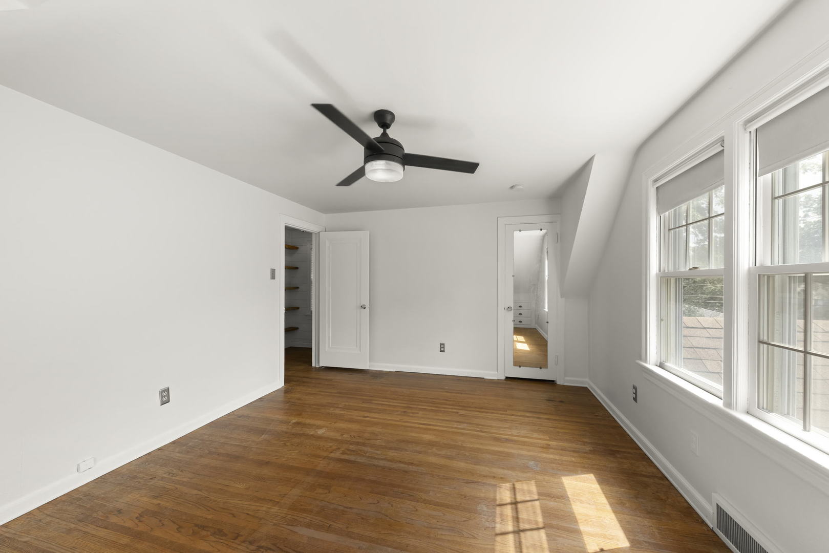 1204 Oneida Street Joliet, IL 60435 - Photo 12 of 30 a view of empty room with wooden floor and fan