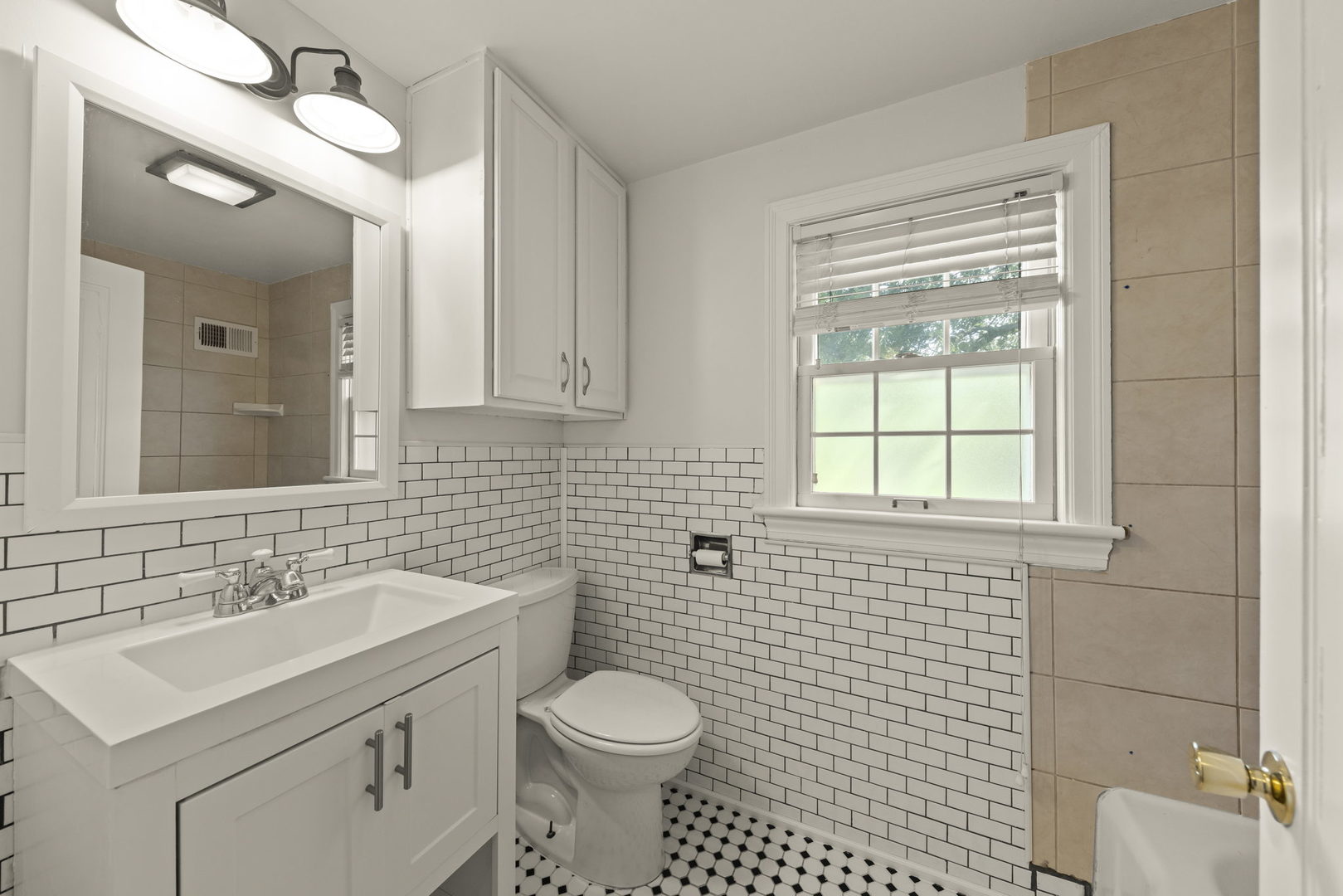 1204 Oneida Street Joliet, IL 60435 - Photo 16 of 30 a bathroom with a sink toilet and mirror