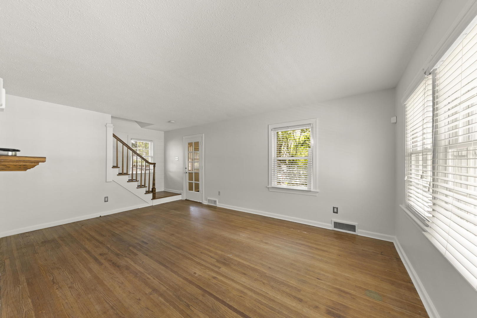 1204 Oneida Street Joliet, IL 60435 - Photo 2 of 30 wooden floor in an empty room with a window