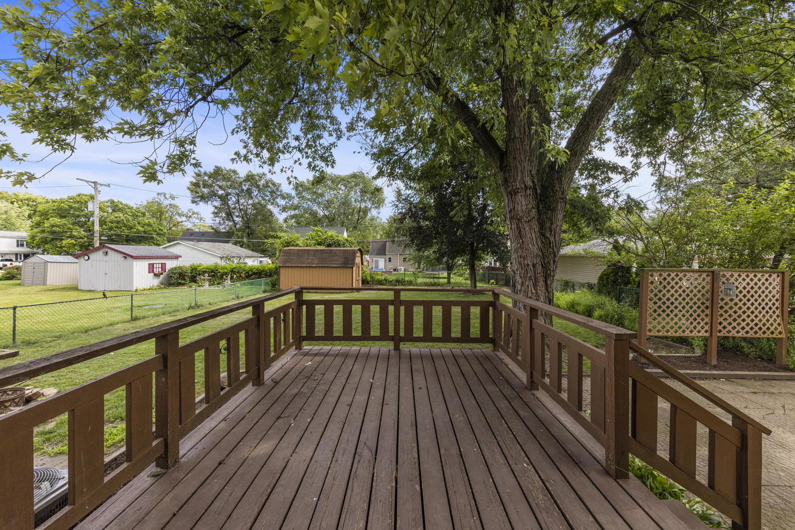 1204 Oneida Street Joliet, IL 60435 - Photo 26 of 30 a view of balcony with wooden floor and fence