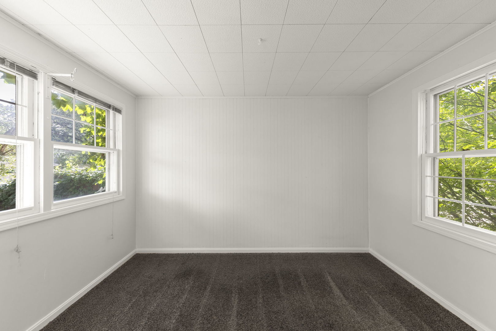 1204 Oneida Street Joliet, IL 60435 - Photo 4 of 30 an empty room with wooden floor and windows