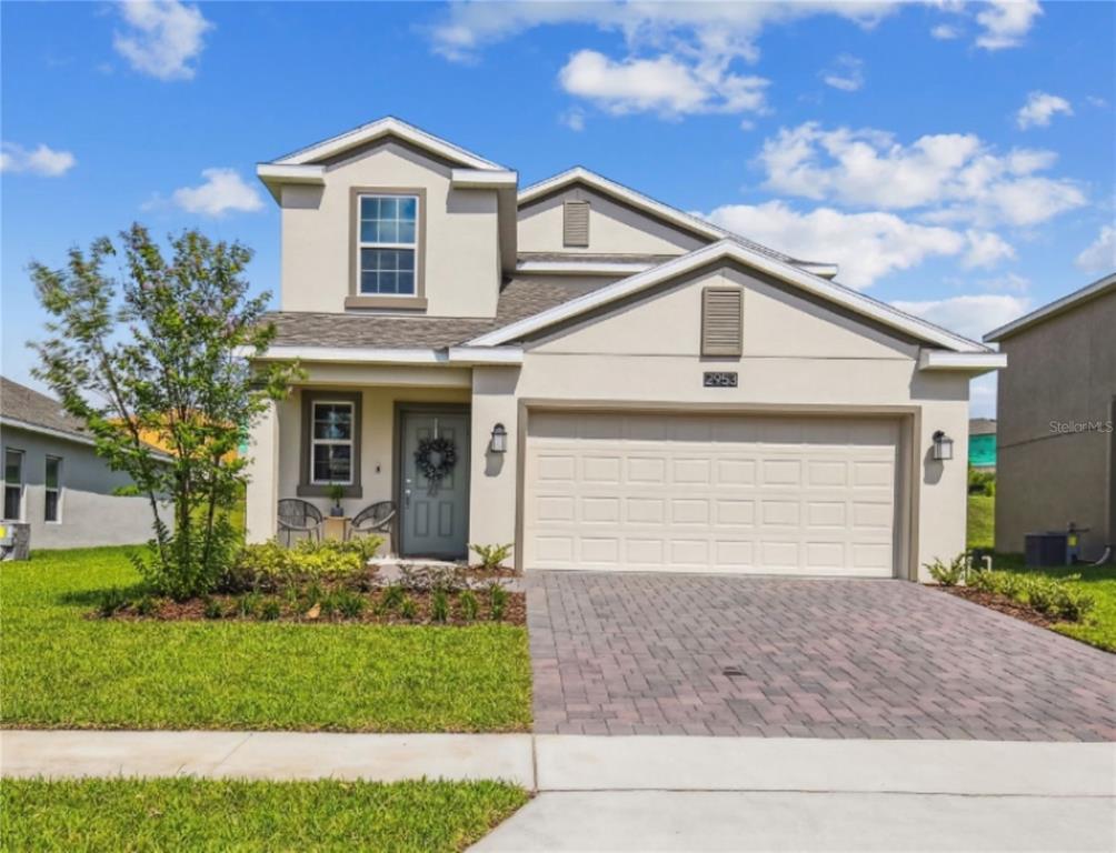 2953 Muller Oak Loop Ocoee, FL 34761 - Photo 1 of 1 a front view of a house with a yard and garage