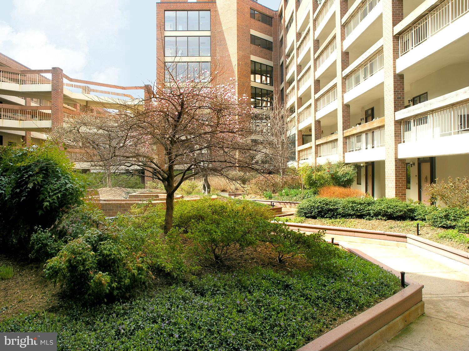 1951 Sagewood Lane, Unit 214 Reston, VA 20191 - Photo 2 of 23 a view of a garden
