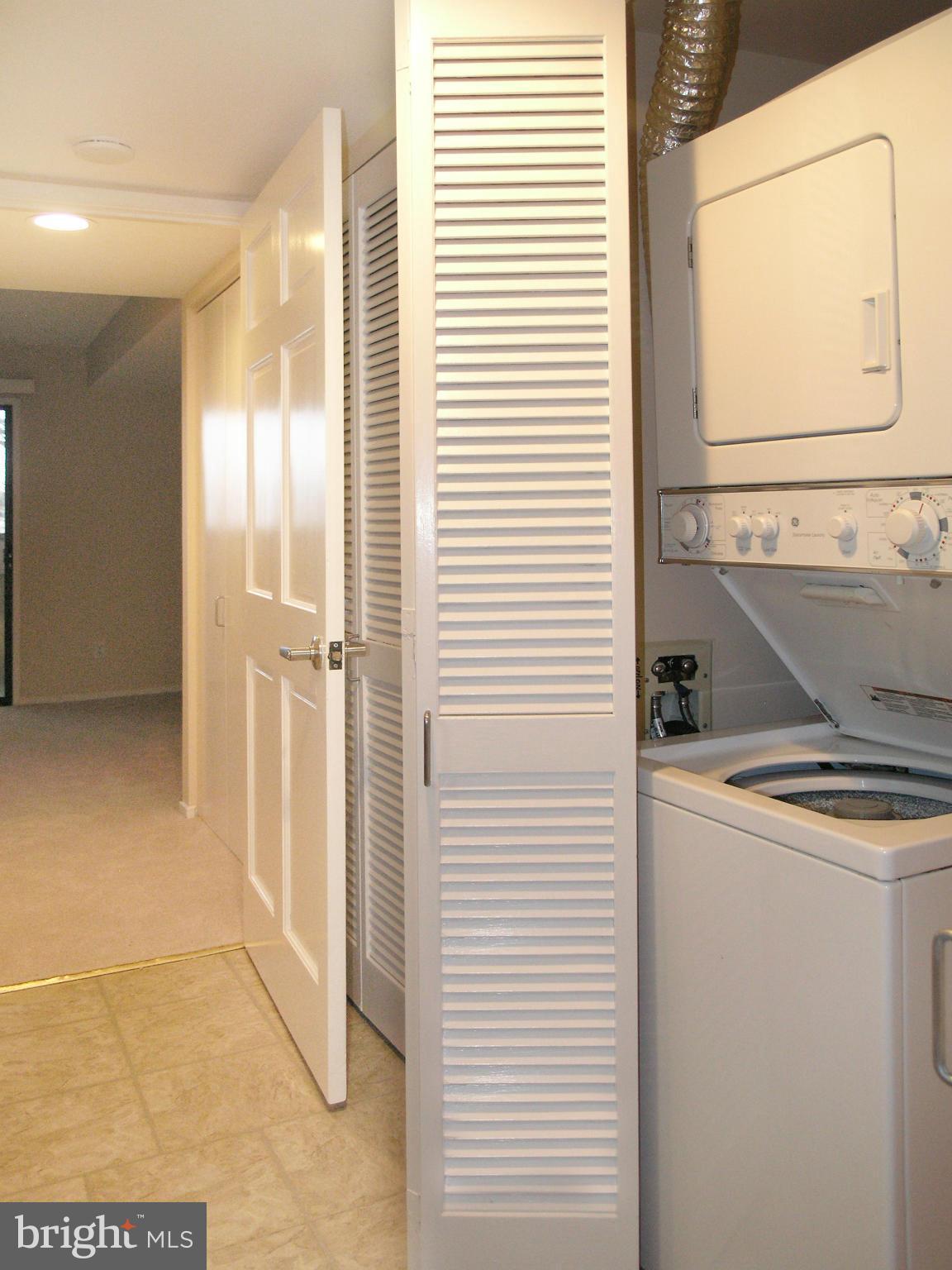 1951 Sagewood Lane, Unit 214 Reston, VA 20191 - Photo 12 of 23 a bathroom with a sink a toilet and shower