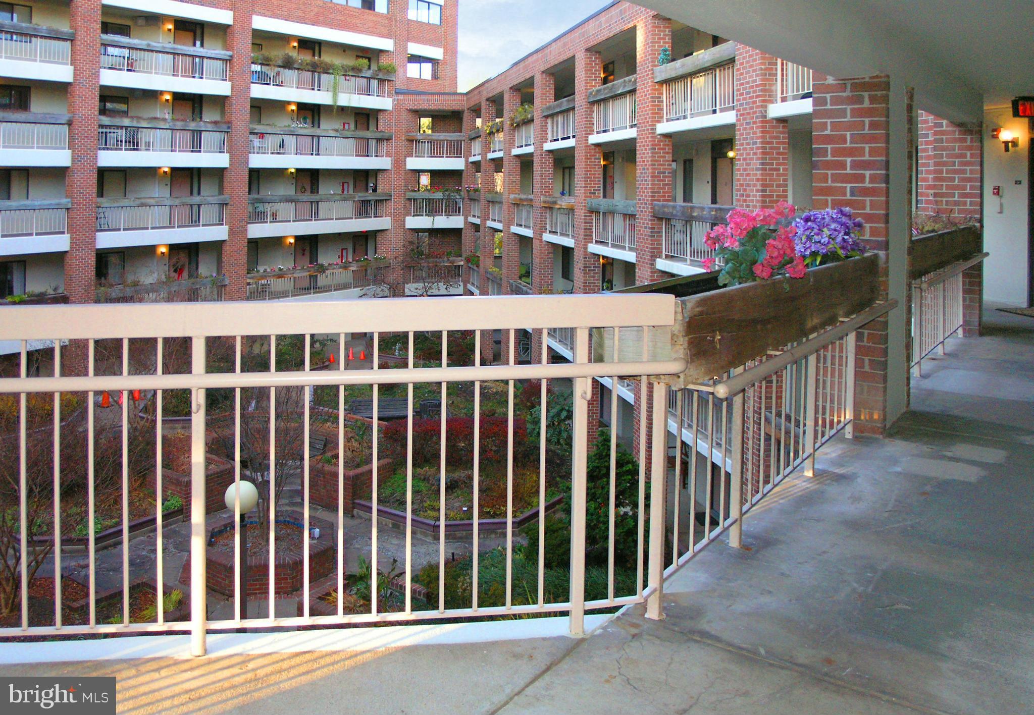 1951 Sagewood Lane, Unit 214 Reston, VA 20191 - Photo 16 of 23 a view of a building from a porch