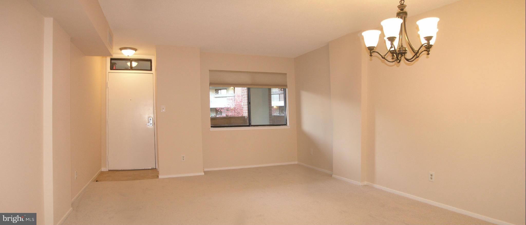 1951 Sagewood Lane, Unit 214 Reston, VA 20191 - Photo 3 of 23 a view of empty room with window