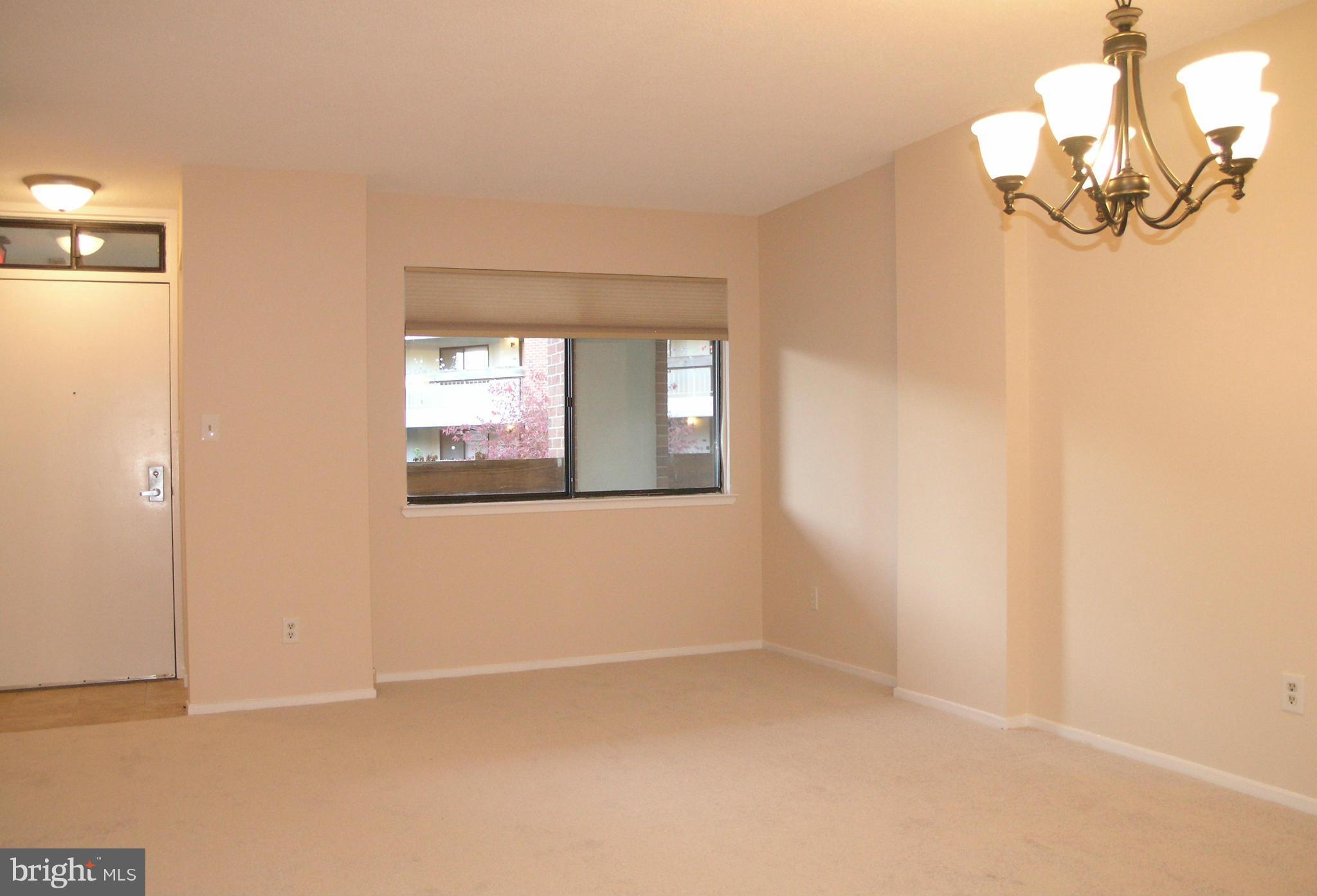 1951 Sagewood Lane, Unit 214 Reston, VA 20191 - Photo 4 of 23 a view of empty room with window