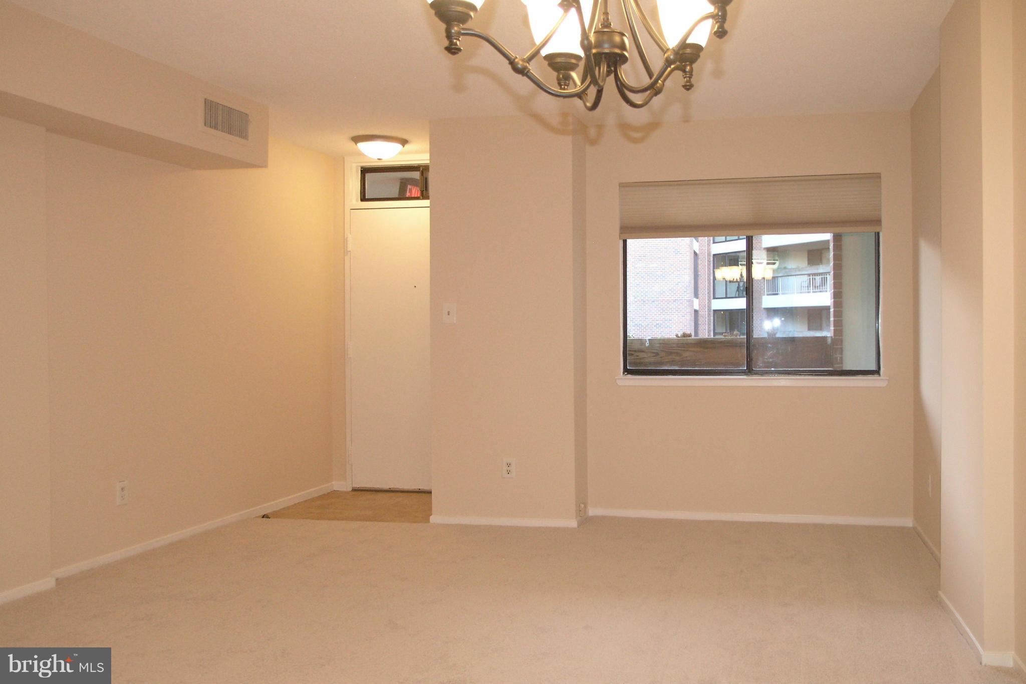 1951 Sagewood Lane, Unit 214 Reston, VA 20191 - Photo 5 of 23 an empty room with windows