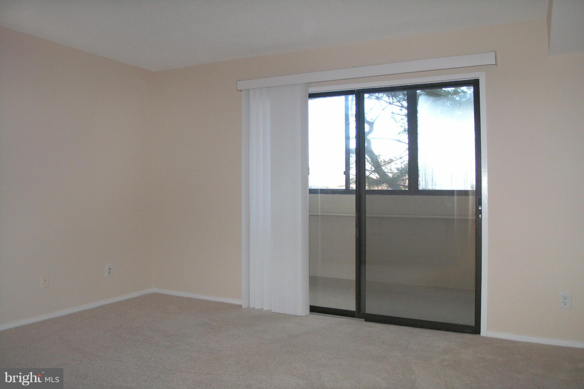 1951 Sagewood Lane, Unit 214 Reston, VA 20191 - Photo 9 of 23 an empty room with window