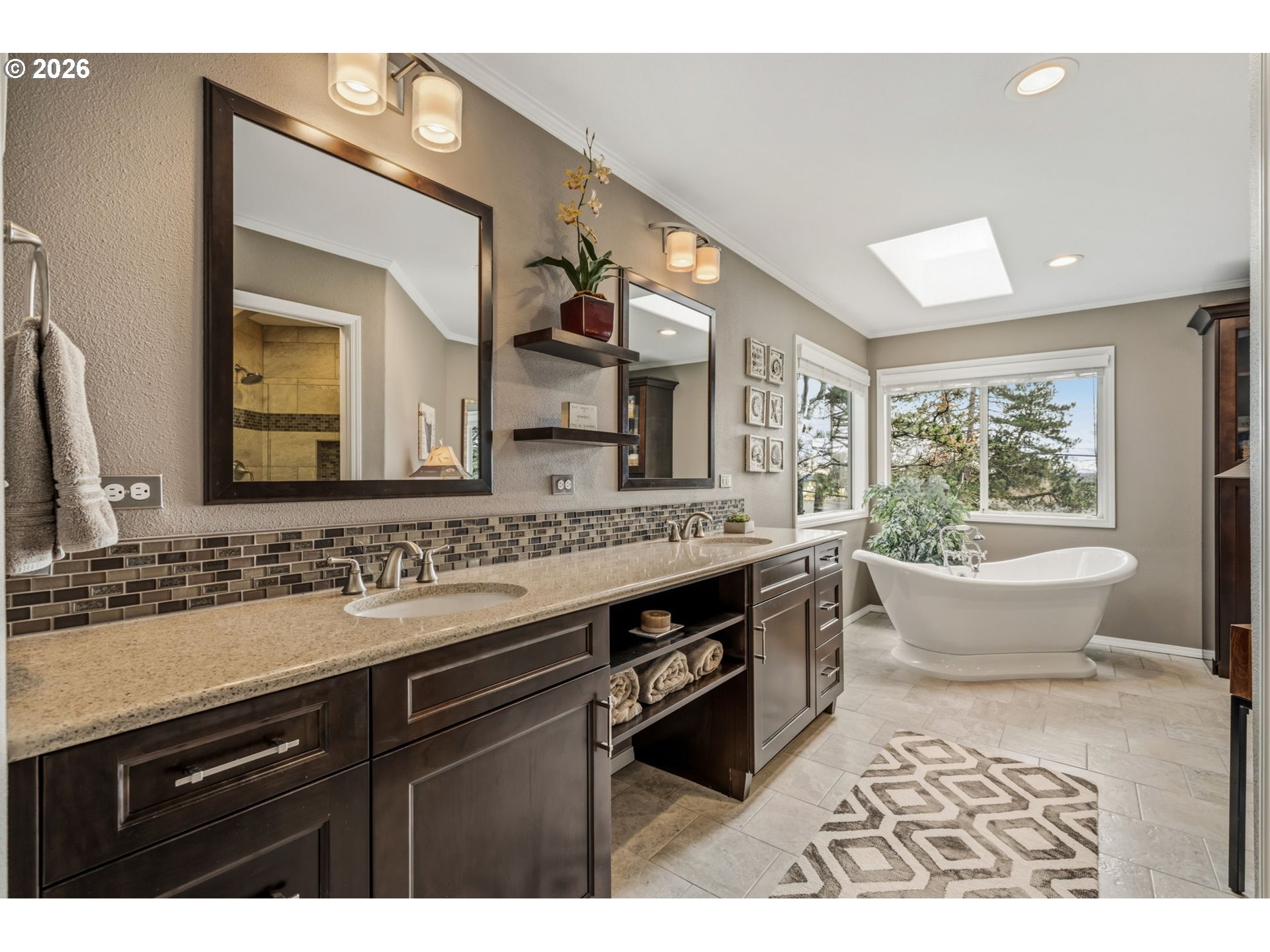 6108 Southwest Kruse Ridge Drive Portland, OR 97219 - Photo 23 of 42 a spacious bathroom with a granite countertop sink and a large mirror