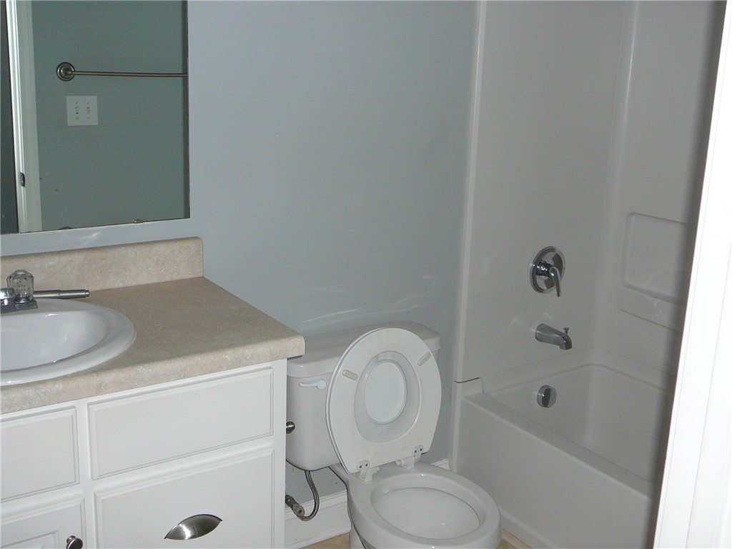 131 Lookover Drive Anderson, SC 29621 - Photo 9 of 18 A well-appointed bathroom offers a convenient combination of vanity, toilet, and bathtub.