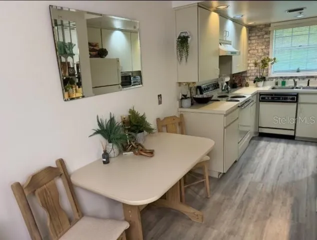 a kitchen with a table and chairs in it