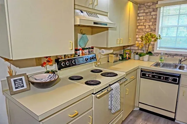 a kitchen with a stove and a table