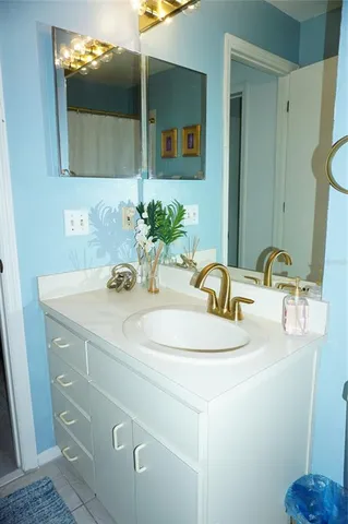 a bathroom with a sink and a mirror