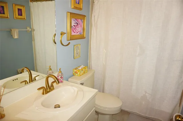 a bathroom with a sink and a toilet
