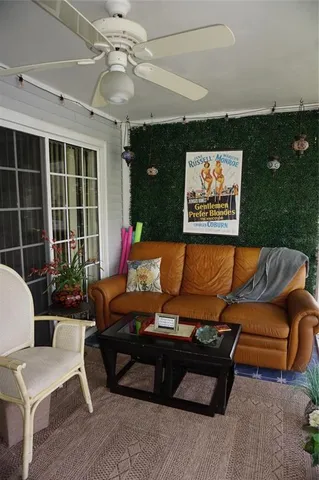 a outdoor living space with furniture and a potted plant