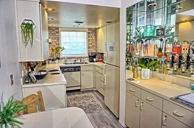 a room with sink washer and dryer