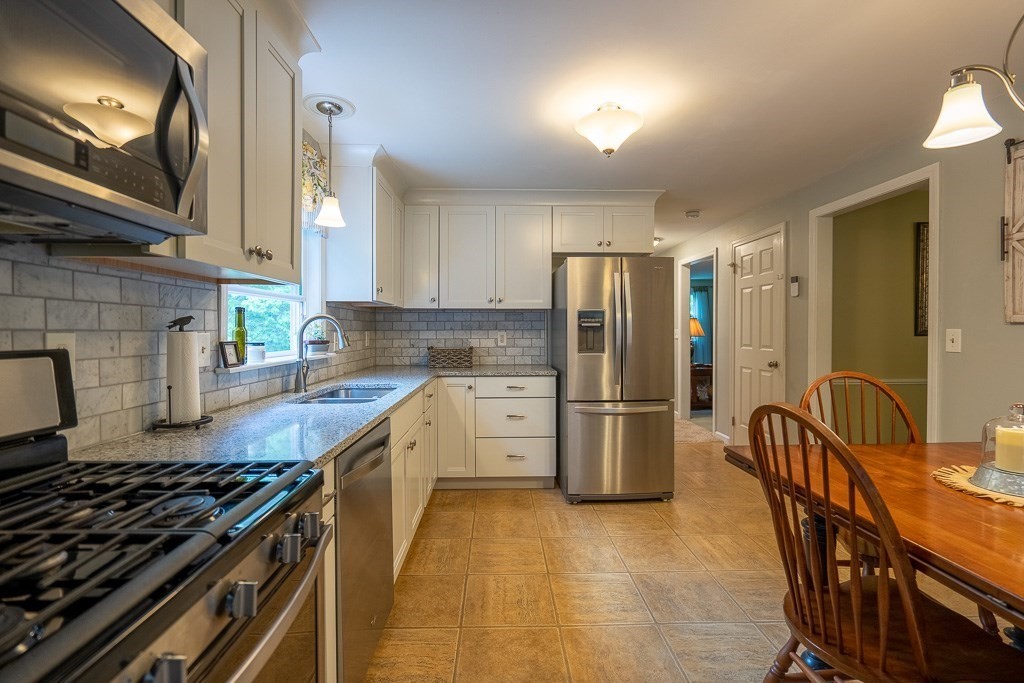 162 West Autumn Road West Springfield, MA 01089 - Photo 8 of 41 a kitchen with refrigerator and cabinets